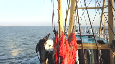 pov from the bridge of a fishing boat on the wadden sea on a sunny winter day