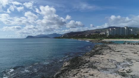 Aerial-Dolly-motion-rocky-coastline-shore,-Ko-Olina-resort-area