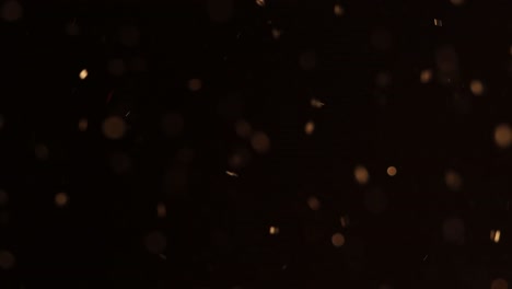 brillo de bokeh brillante dorado con reflejos rojos para superposición de película