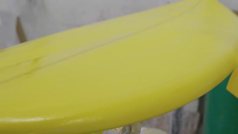 male surfboard maker in his workshop