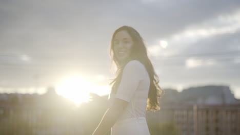 spanish youth model posing candidly on rooftop