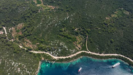 Boats docked along Mljet’s coast, transitioning to a wide aerial view of nearby islands