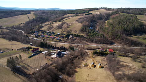 Aerial-backwards-view-of-rural-area-of-Polanczyk