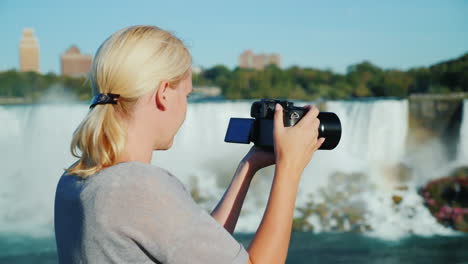 woman filming niagara falls