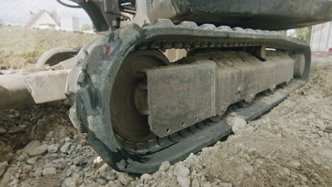 Parallax-close-up-shot-of-the-crawler-of-a-mini-excavator