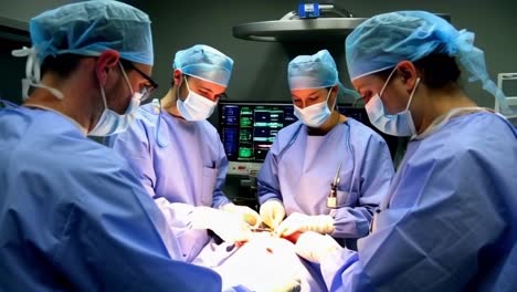 a group of surgeons are performing a surgery