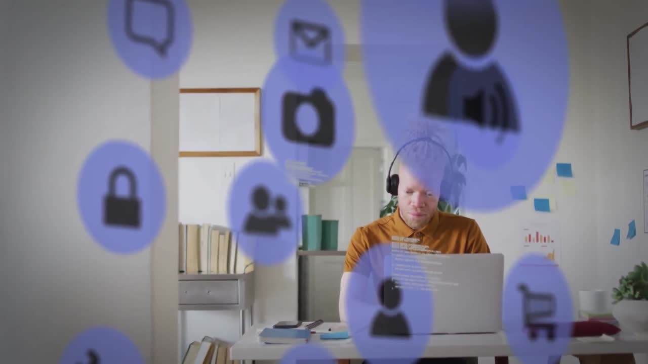 animación de iconos de los medios sobre un hombre de negocios albino afroamericano que usa una computadora portátil