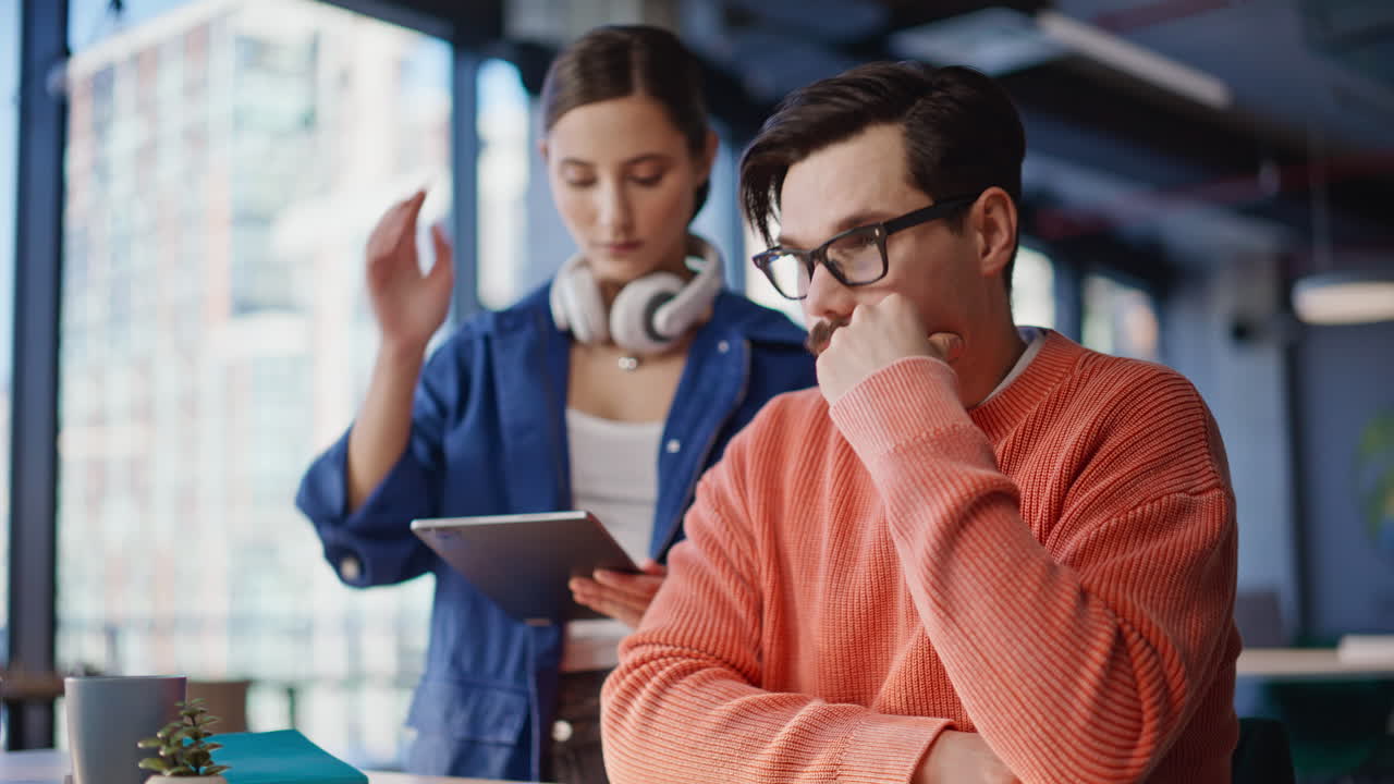 Stressed business people videocalling at office closeup. Nervous man woman