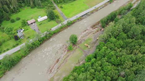 Aerial-Perspective:-Saturated-River-with-Eroded-Banks-and-Dump-Truck-in-Flooded-Vermont