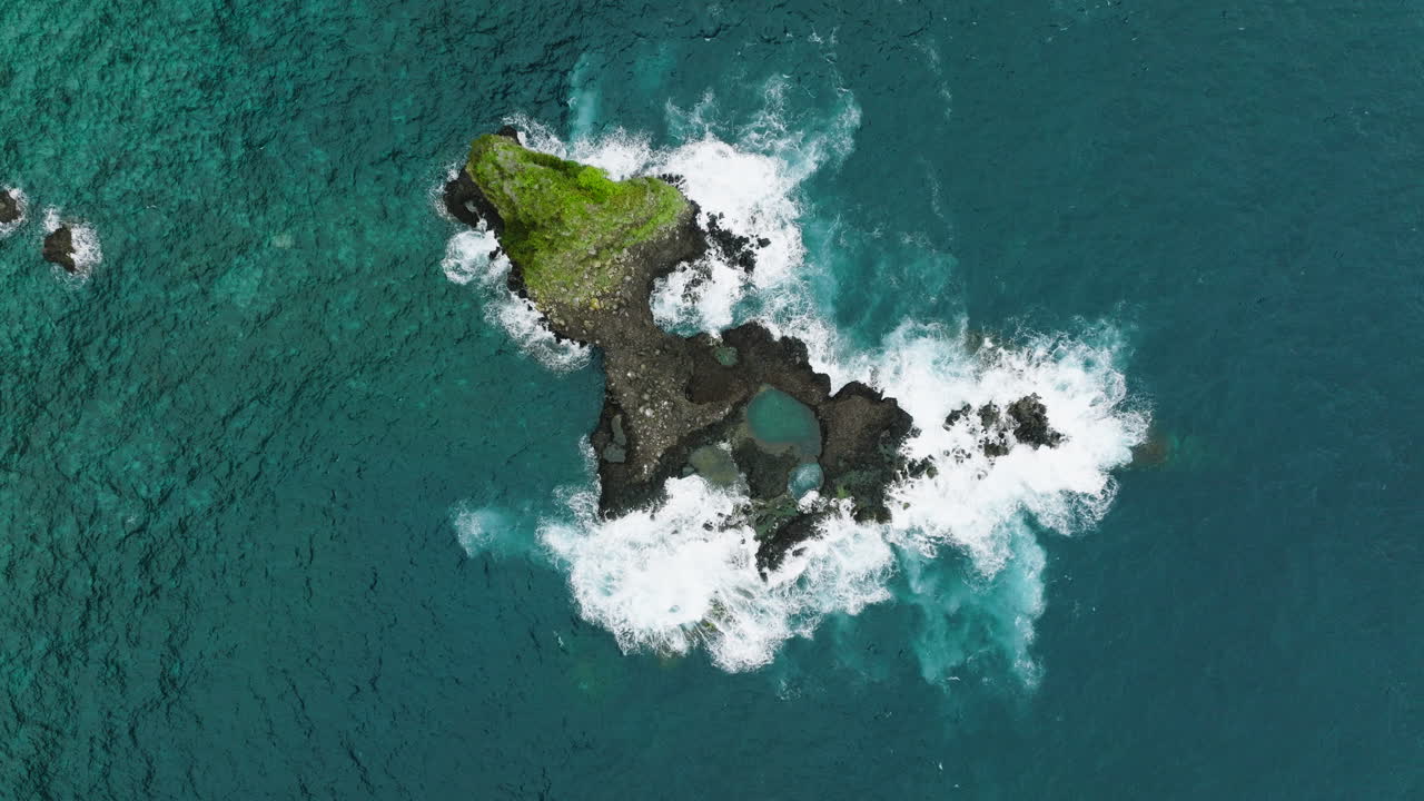 Premium stock video - Volcanic islet in atlantic ocean off madeira coast