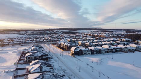 Aerial-view-of-a-suburban-community-at-sunset-in-Calgary,-Alberta-in-winter