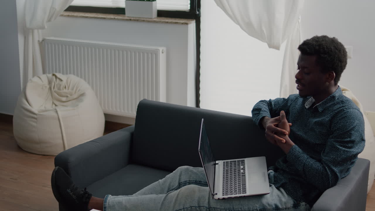 Remote african american worker on internet web online communication talking with his boss