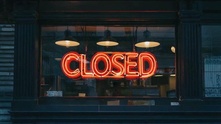Closed Neon Sign in a Shop Window