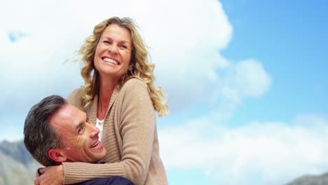 Mature-couple-enjoying-on-beach