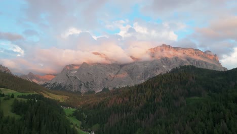 An-evening-aerial-orbit-view-of-the-Sas-dles-Nü-mountain-covered-in-beautiful-clouds