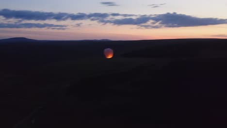 Drone-shot-at-dusk-of-a-sky-lantern-over-peatland-on-the-Isle-of-Lewis