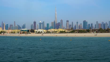 towering burj khalifa on the modern city of dubai at jumeirah beachfront in united arab emirates