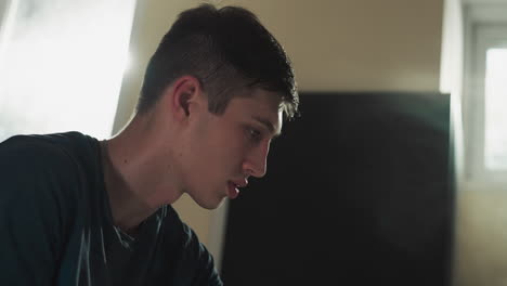 sportsman rests after training in gym closeup. young man concentrates before starting difficult exercise in sports club slow motion. active leisure