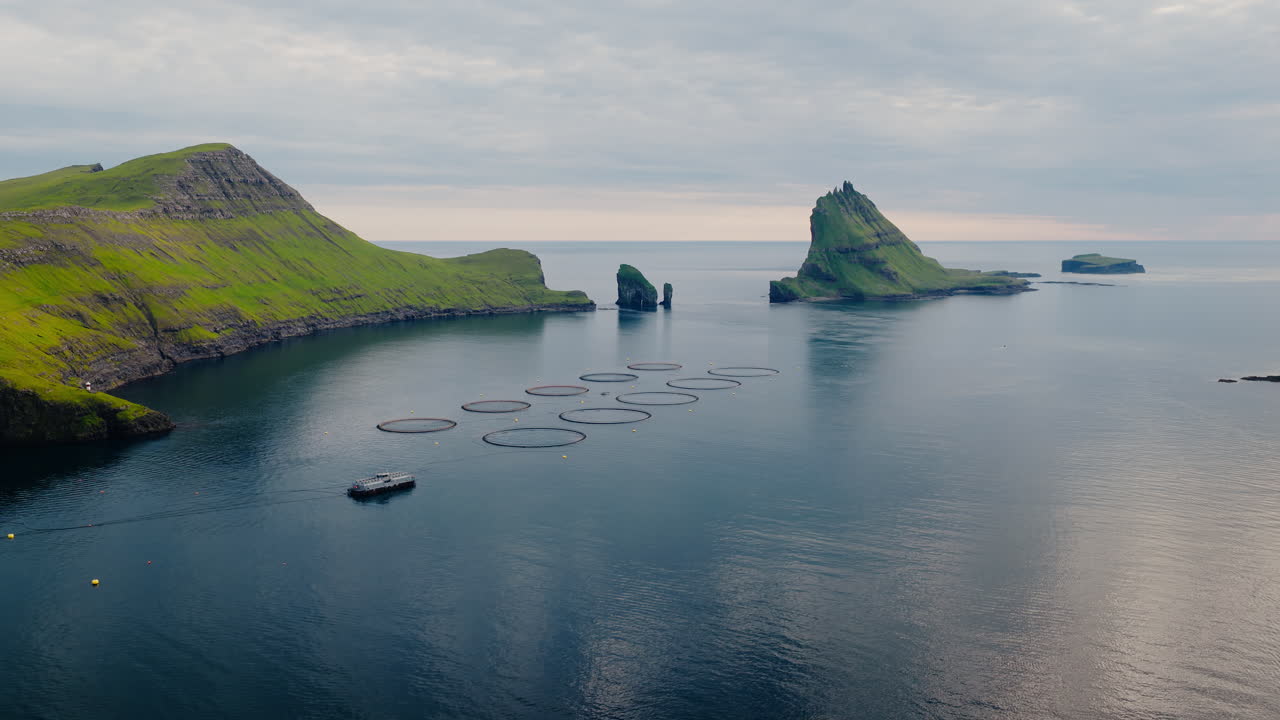 Panoramic view of a fish farm near Drangarnir and Tindhólmur in the Faroe Islands