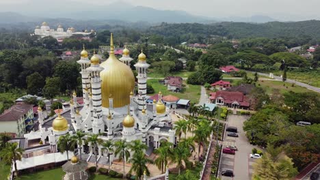 orbit drone shot of malaysian muslim mosque masjid in kuala kangsar perak