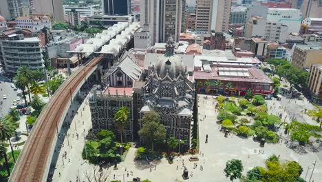 orbiting drone footage showing beautiful crowded square of botero in colombia