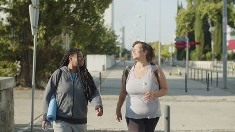 front view of happy fat women going to gym in sportswear