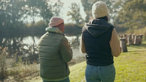 talking, back and couple walking in nature