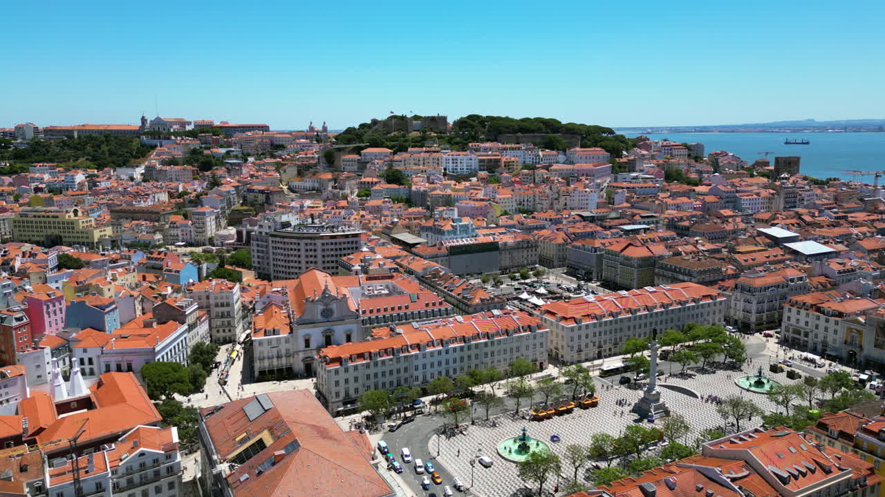 Panoramic drone overview of the Rossio square in downtown Lisbon, summer day