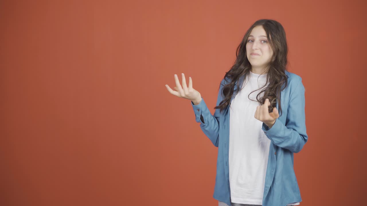 The young woman promoting is looking at the camera in surprise.