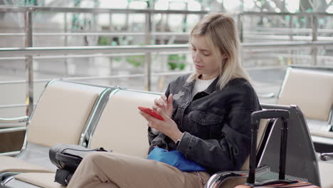 woman using smartphone at the airport