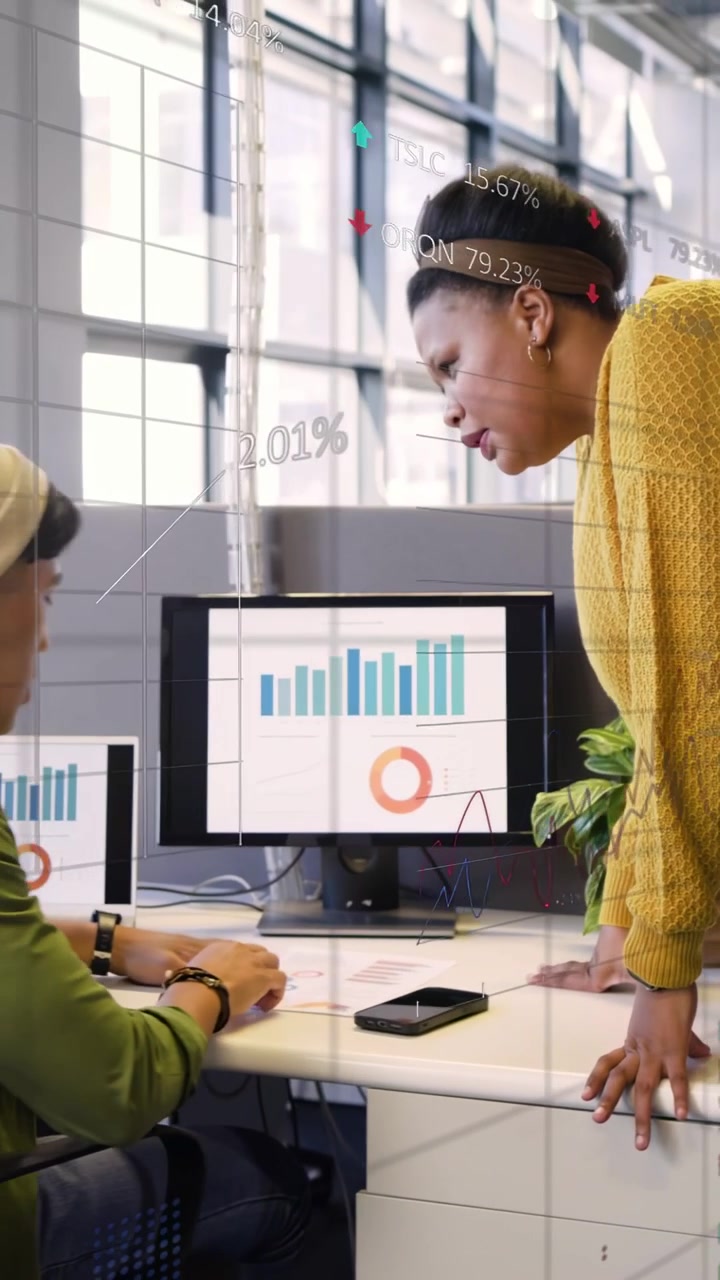 Analyst sorting pages, manager coming, pointing at bar donut charts with tickers, analyzing finance