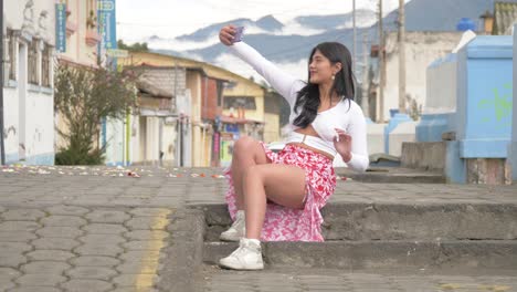 latina girl selfie on country road with beautiful mountains background in machachi city, pichincha province, ecuador