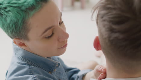 Close-Up-Of-Loving-Woman-Tenderly-Caressing-Her-Boyfriend's-Head-At-Home