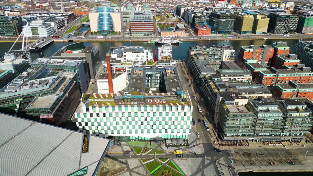 Aerial drone view of Dublin Docklands featuring the iconic Samuel Beckett Bridge and Convention Centre Dublin