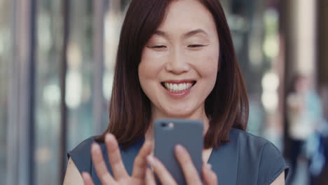 portrait of japanese businesswoman outside corporate office building