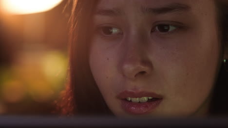 close up portrait beautiful asian woman using tablet computer watching movie laughing enjoying comedy entertainment relaxing at home