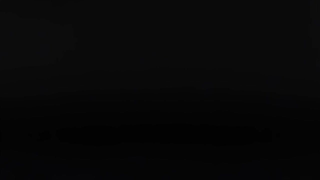 A pink sphere repeatedly moves vertically against a dark backdrop, showcasing rhythmic motion.