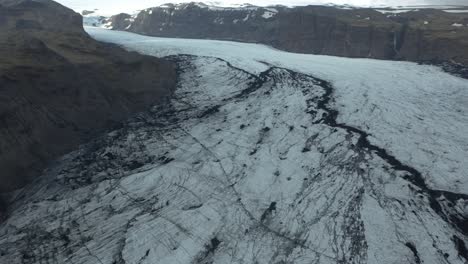 cracked ice surface of frozen mass, sólheimajökull glacier, aerial