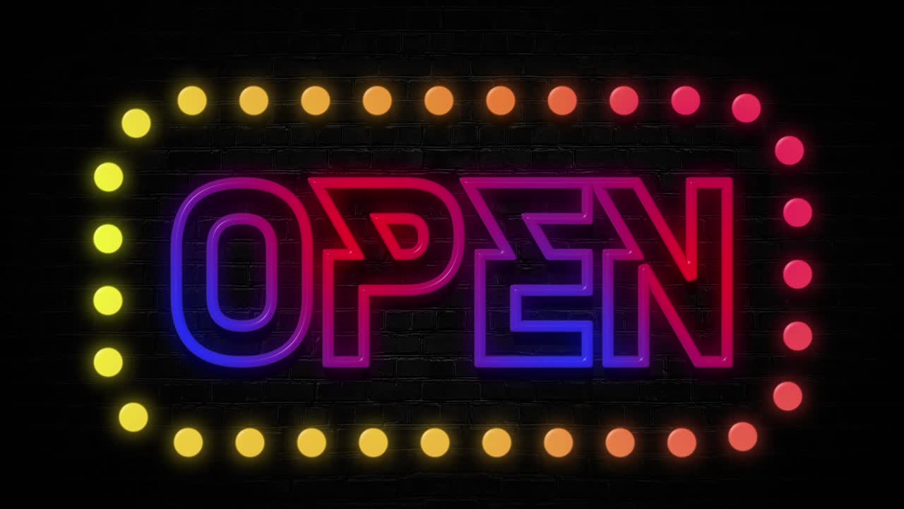 open colorful neon sign with on brick black wall