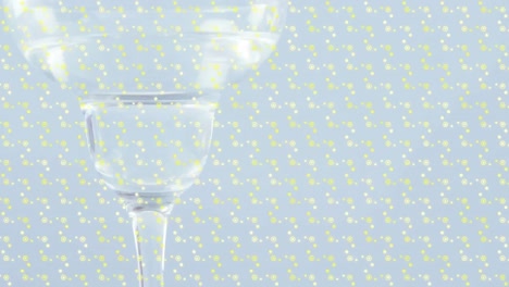 animation of shapes over drink in glass on white background