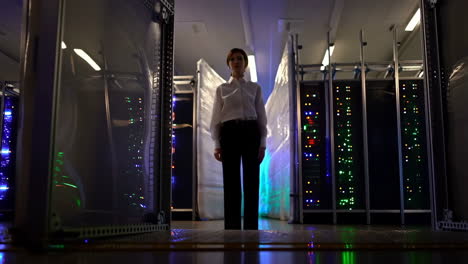 woman standing in a server room