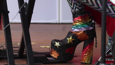 a close-up of a seventies-era high-heeled boot at a music festival in columbia, missouri