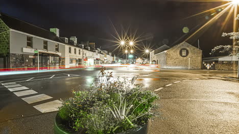 a panning time image of the traffic in the streets of a village