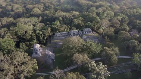 an aerial view over palenque mayan pyramids in mexico 1