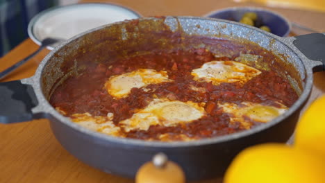 adding salt to homemade shakshuka