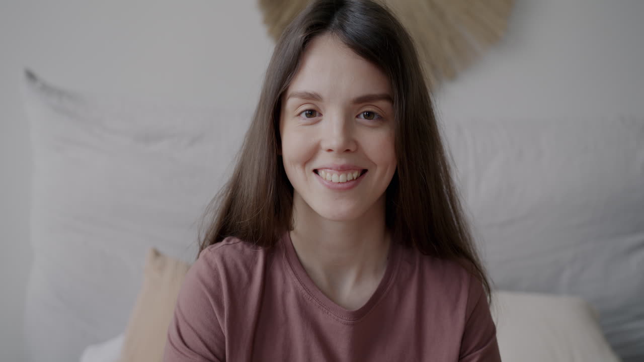 Smiling Woman in Bedroom