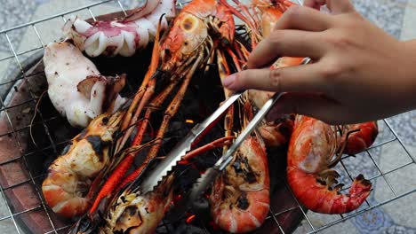 top view of shrimps and octopus frying on the barbeque