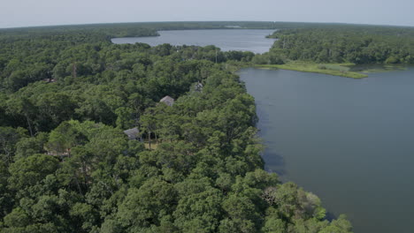 Aerial-flyover-houses-and-lakes-in-Cape-Cod,-Massachusetts