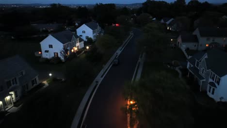 aerial view of a quiet suburban neighborhood at night