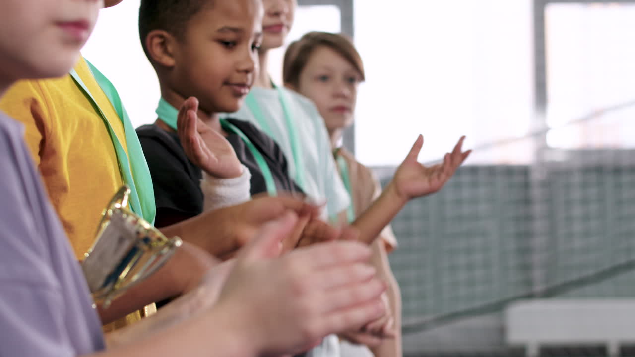 Kids with medals and trophy